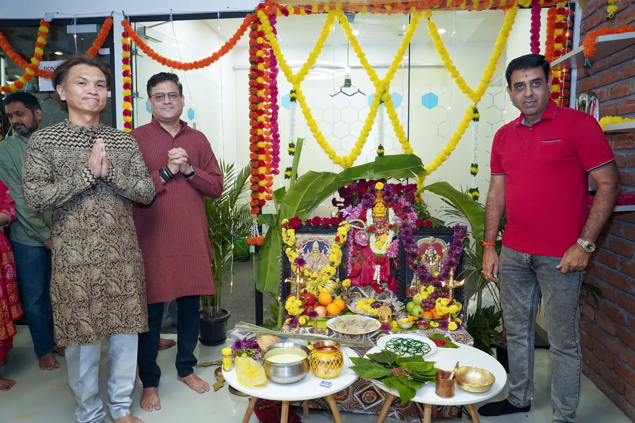 Ripplrites beside the decorated Ganesh Chaturthi shrine in the office